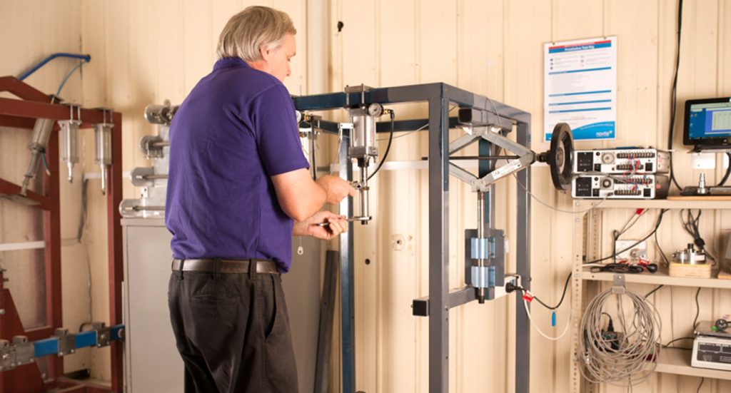 Man working with testing equipment in the Novitatech test lab